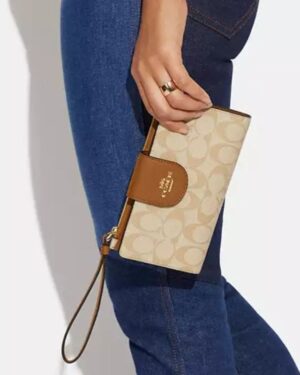 Coach Phone Wallet In Signature Canvas